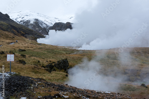 high temperature warning sign and steam rising from the ground, Iceland