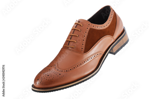 Single brown leather and suede mens shoe inclined isolated on a white background with clipping path