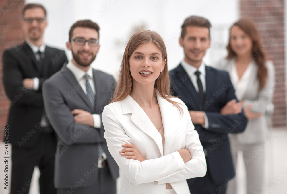young businesswoman on the background of her business team young businesswoman on the background of her business team