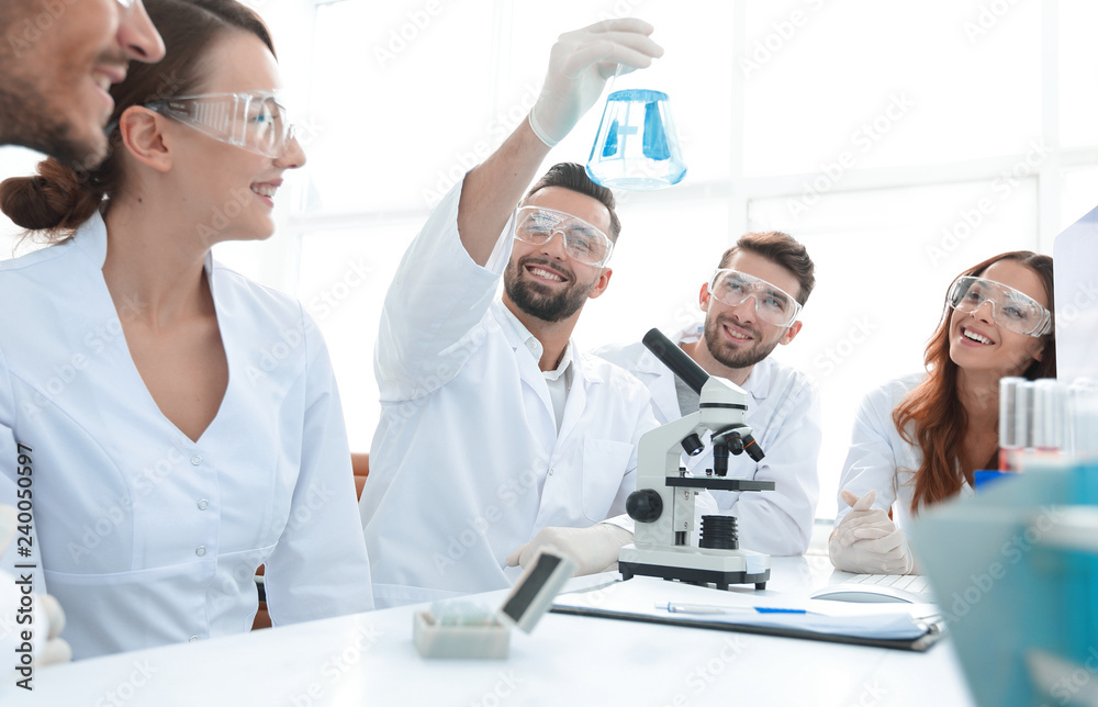 group of young workers are working in biochemistry lab, group of young workers are working in biochemistry lab,