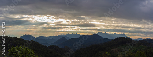 Sun rays with early morning sky and mountain scene © AungMyo