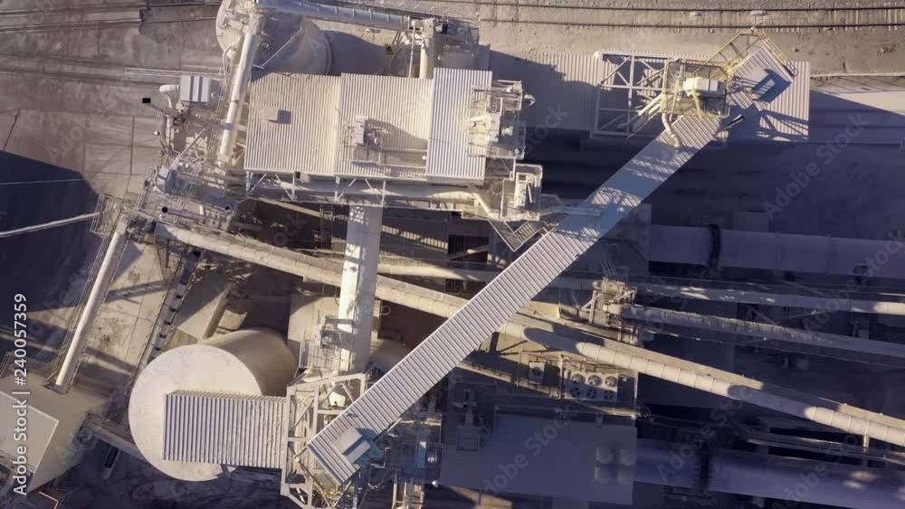 Looking straight down on industrial mill with giant rotating turbines. Looking straight down on industrial mill with giant rotating turbines.