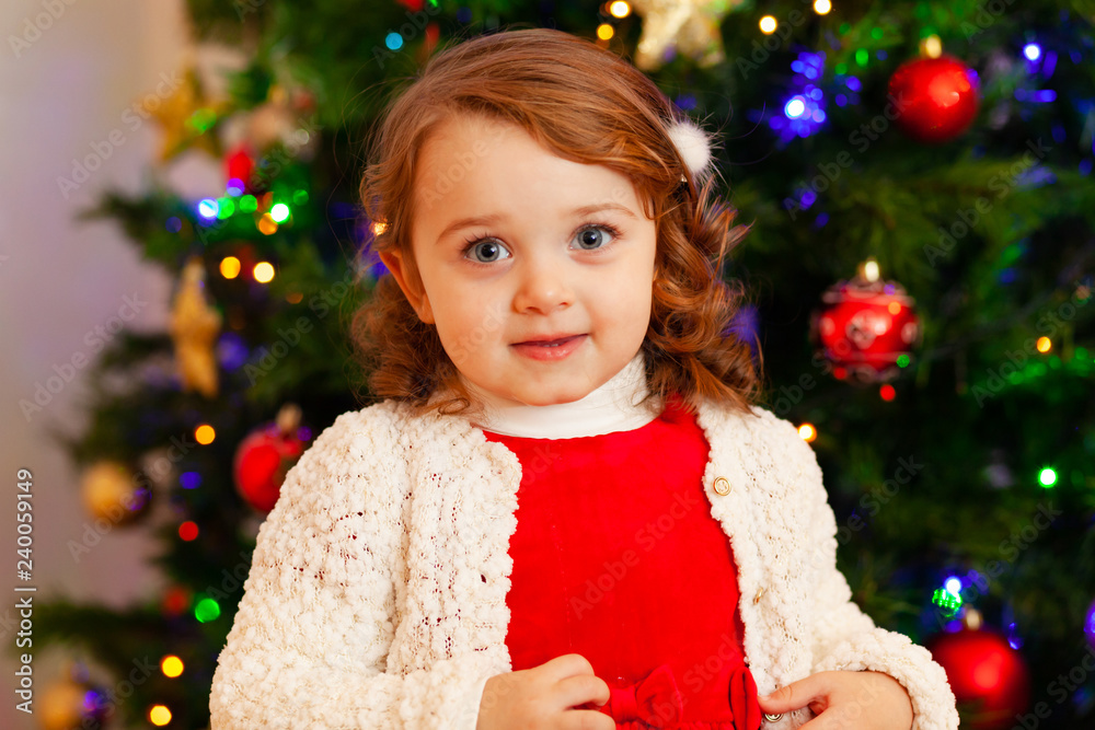 Beautiful little child near Christmas tree. Beautiful little child near Christmas tree.