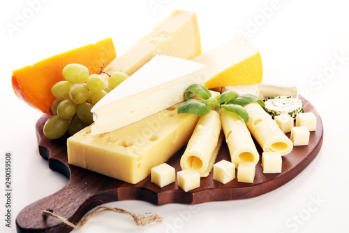 Cheese plate served with grapes, various cheese on a platter
