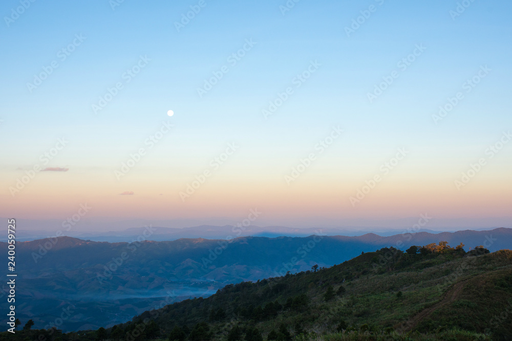 Mountain view with moon in morning.