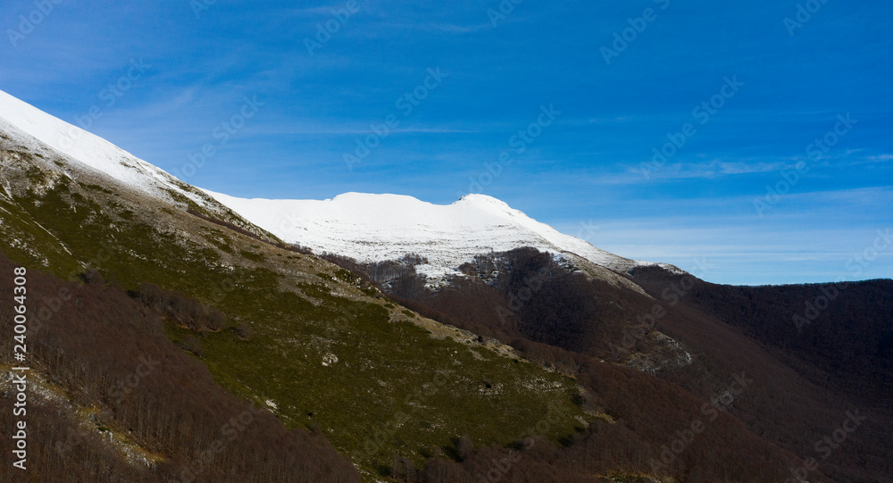 Aerial view of a beautiful Italian snowy Mountain. Winter season in Italy. Aerial view of a beautiful Italian snowy Mountain. Winter season in Italy.