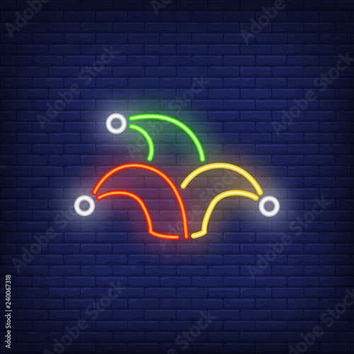 Jester hat neon sign. Circus performance advertisement design. Night bright neon sign, colorful billboard, light banner. Vector illustration in neon style.