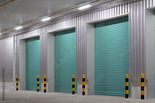 Roller door or roller shutter. Also called security door or security shutter with automatic system. For protection industrial building i.e. factory, warehouse, hangar, workshop, store, hall or garage.