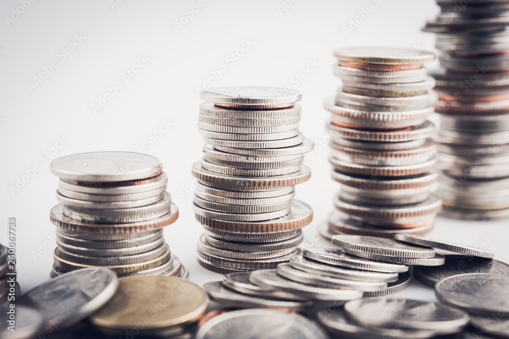 money coins arranged as a graph on white background money coins arranged as a graph on white background