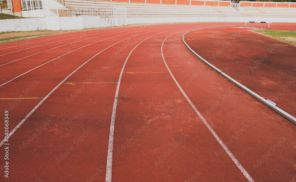 Red running track lines in stadium.