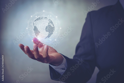 business man hand with virtual screen World map , network connection, international meaning,Technologies connecting the world copy space