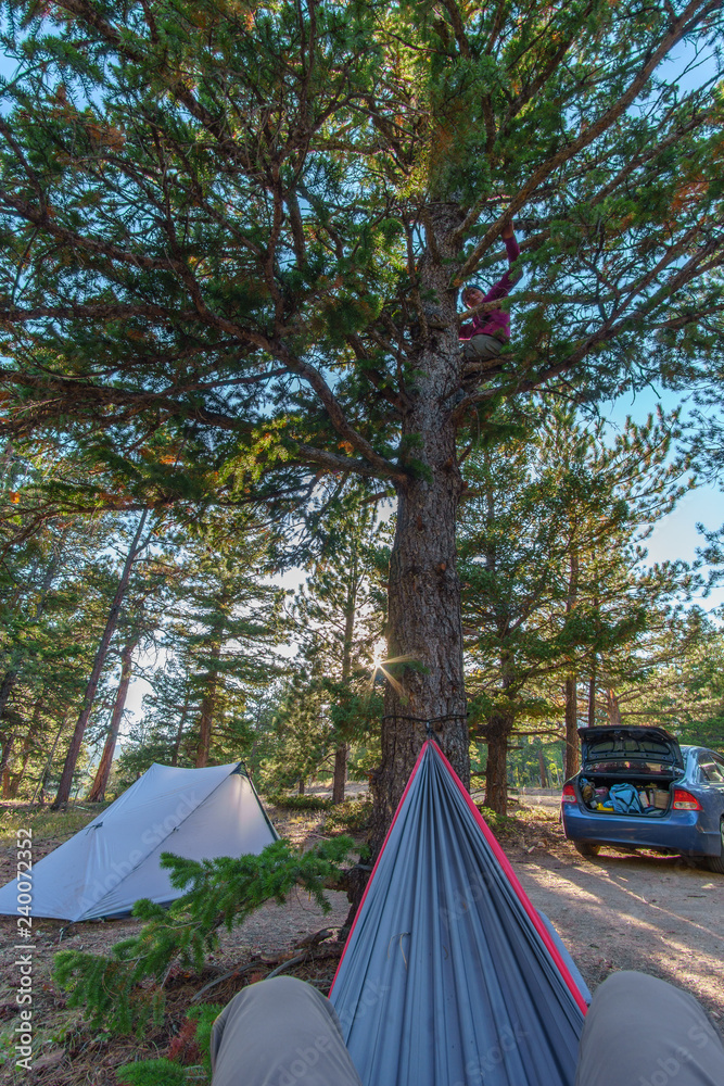 Hammock, Tent, and Car with Sun flair in sky