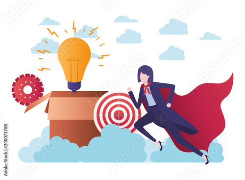 businesswoman with hero cape and target shooting