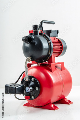 Red surface water pump. White background