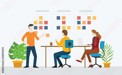 agile team working together with stick notes sprint task on the office