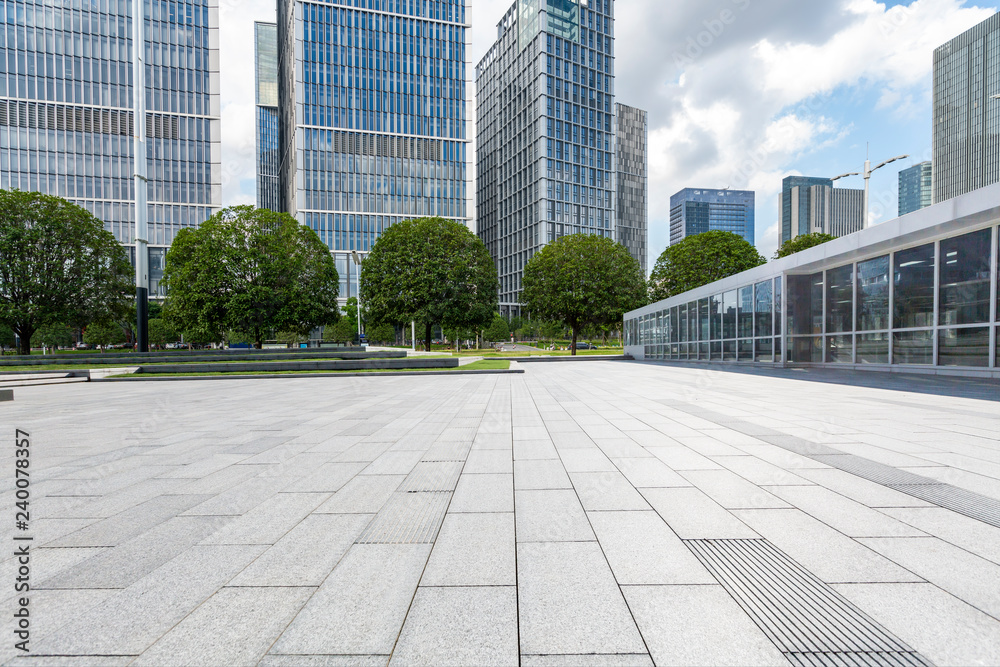 Panoramic skyline and modern business office buildings with empty road,empty concrete square floor Panoramic skyline and modern business office buildings with empty road,empty concrete square floor
