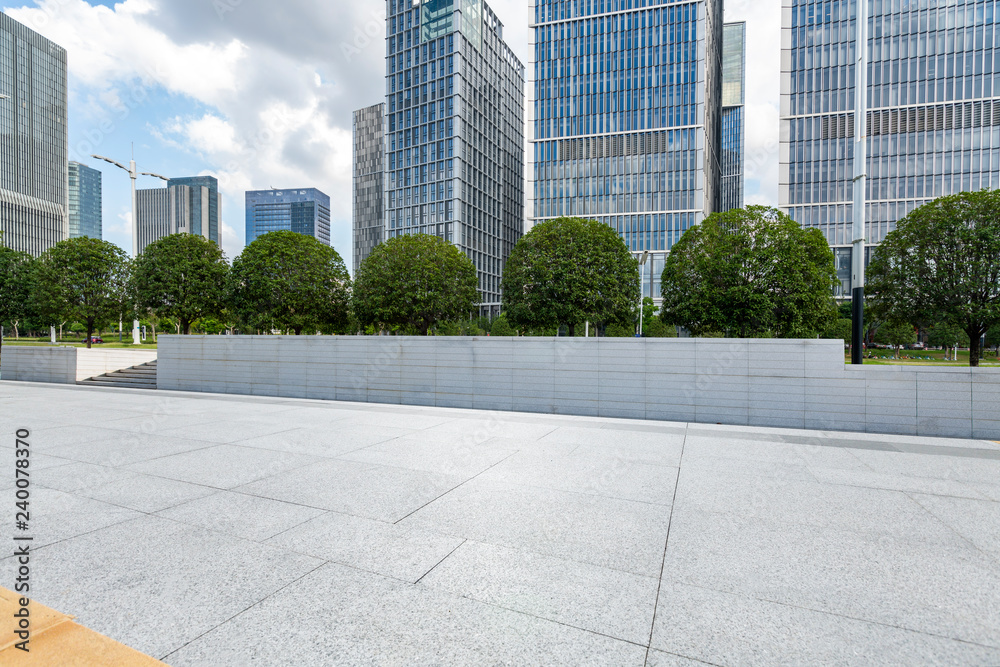 Panoramic skyline and modern business office buildings with empty road,empty concrete square floor