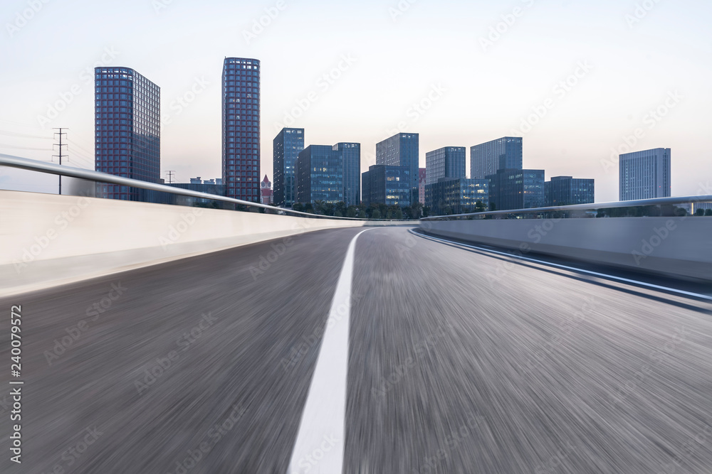 Panoramic skyline and modern business office buildings with empty road,empty concrete square floor Panoramic skyline and modern business office buildings with empty road,empty concrete square floor