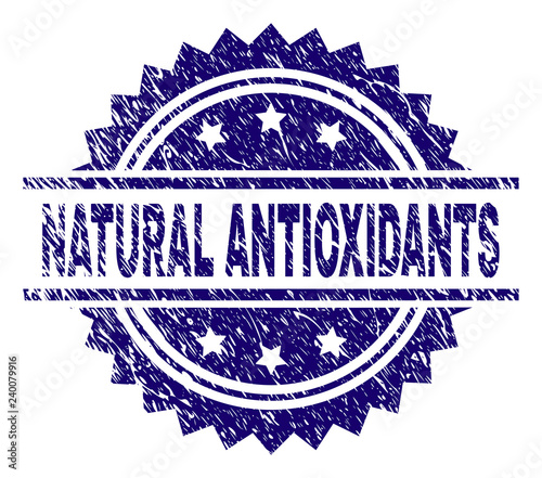 NATURAL ANTIOXIDANTS stamp seal watermark with distress style. Blue vector rubber print of NATURAL ANTIOXIDANTS tag with dirty texture.