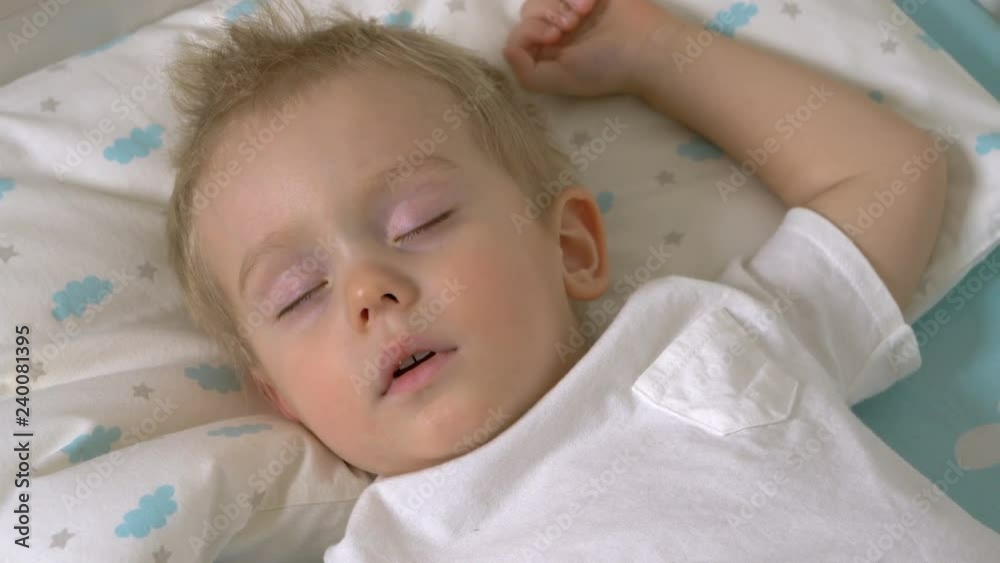 Cute baby boy is sleeping in daytime
Cute baby boy is sleeping in daytime