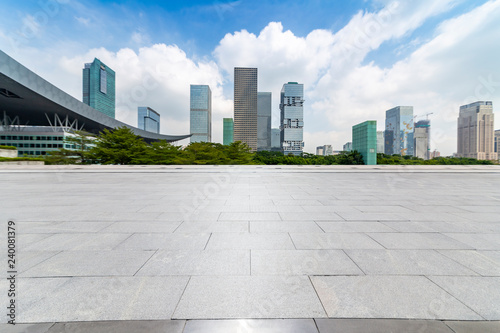 Panoramic skyline and modern business office buildings with empty road,empty concrete square floor © MyCreative