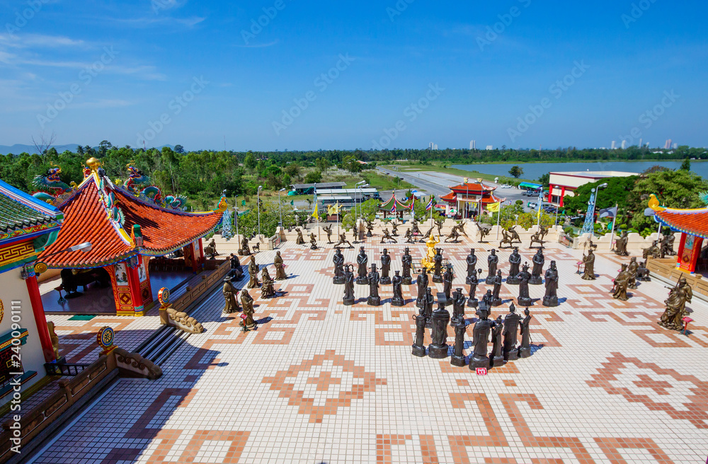 Naklejka premium Pattaya, Thailand, Chinese temple of Viharn Sien. Playground in front of the temple. On the site in front of the temple built an army of sculptures of Shaolin warriors in combat poses and monks.