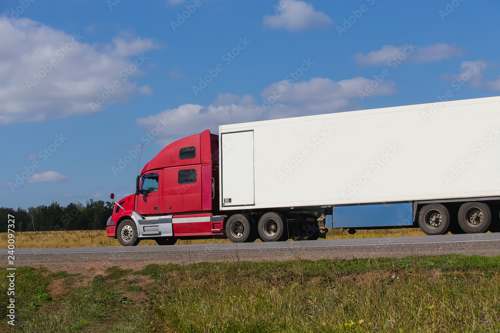 Large semi-trailer moves on a country road Large semi-trailer moves on a country road