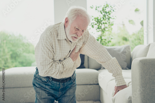 Photography Sad tired stylish old man wearing checked shirt leaning on divan