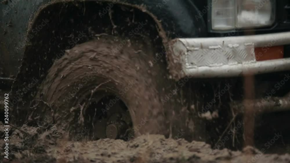 Jeep rides through the mud in the woods Jeep rides through the mud in the woods