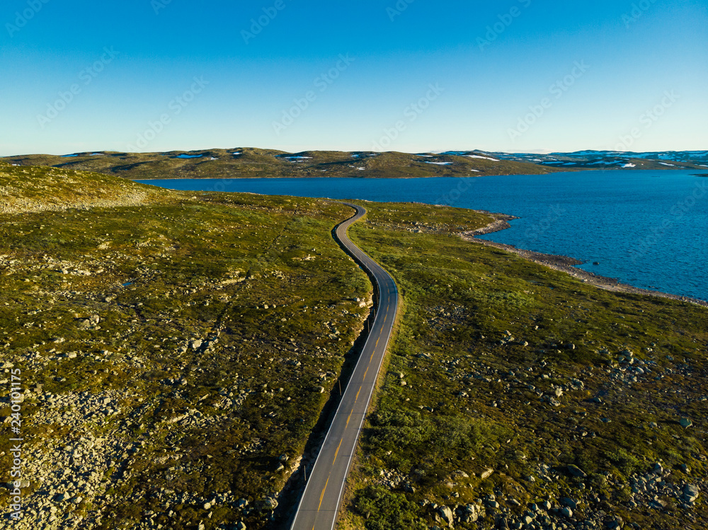 Road crossing Hardangervidda plateau, Norway. Aerial view.