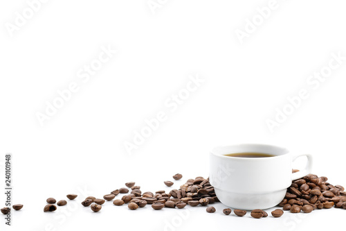 Coffee cup and coffee beans was poured on a white background.