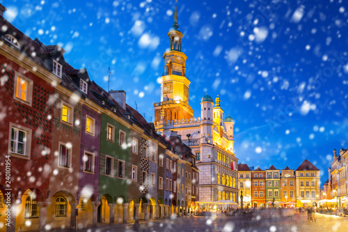 Old town of Poznan on a cold winter night with falling snow, Poland