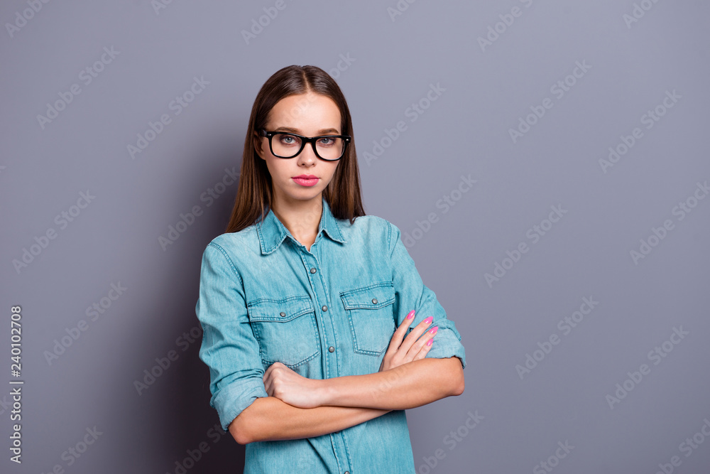 Close up portrait of self-confident standing in stern pose looki Close up portrait of self-confident standing in stern pose looki