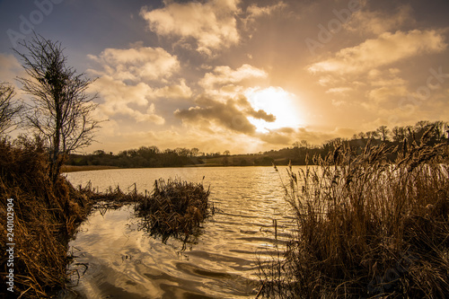 Sunset over Combe Valley winter-flooded marshes near Bexhill  in East Sussex  England