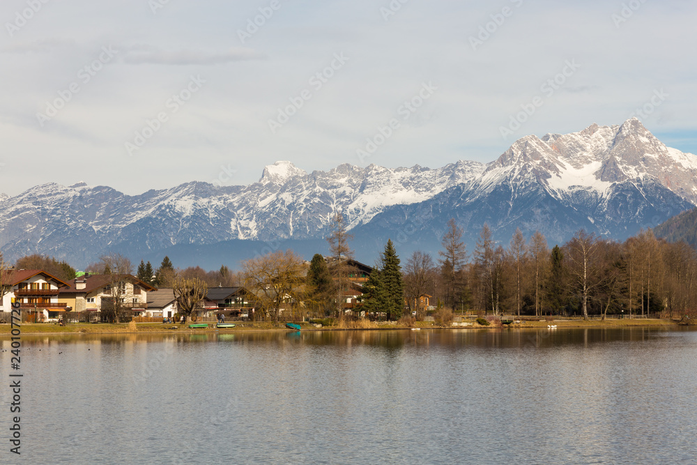 winter lake with snow topped mountains
