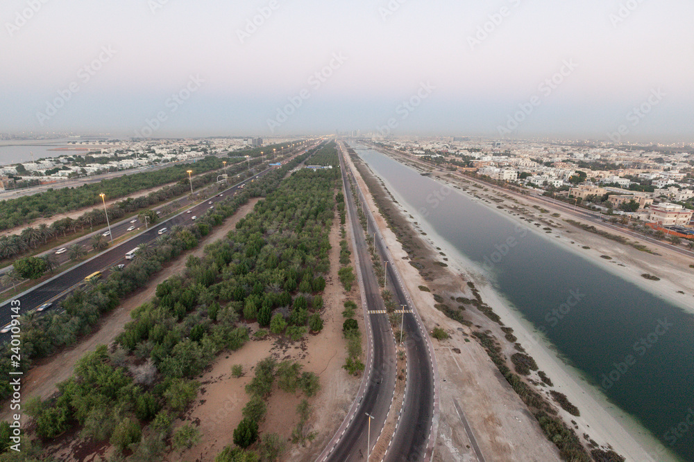 Dusk view along Al Maqta channel towards downtown Abu Dhabi, United Arab Emirates