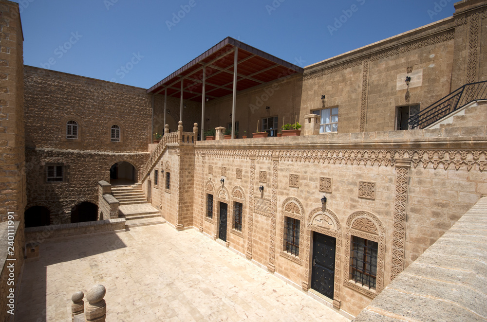 Mardin, Midyat / Turkey - May 17 / 2015: Wide angle courtyard view of Mor Gabriel (Deyrulumur) monastery