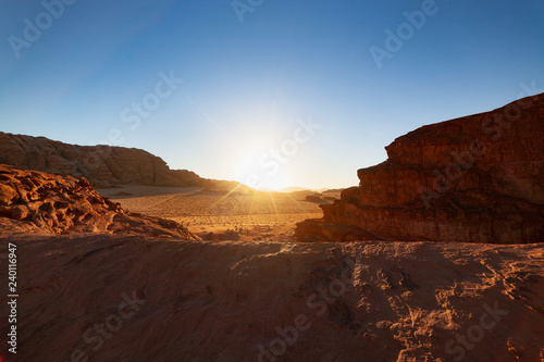 Fototapeta Naklejka Na Ścianę i Meble -  Amazing Sunset on Red Desert Wadi Rum in Jordan
