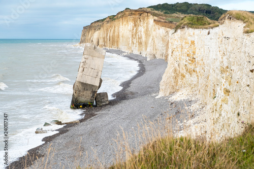 A fallen from the cliff German concrete bunker from World War Two on the beach of Sainte-Marguerite-sur-mer, France.