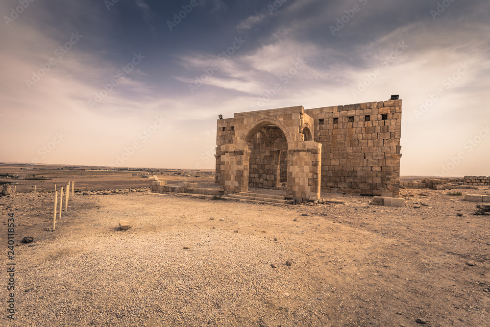 Jordan - September 30, 2018: Ruins of an ancient castle in the dunes of the desert of Jordan