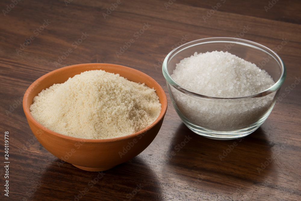 Food: Closeup of White and Brown Sugar Isolated on Wooden Background Food: Closeup of White and Brown Sugar Isolated on Wooden Background
