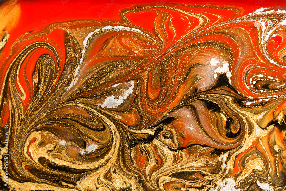 Gold marbling texture design. Red and golden marble pattern. Fluid art.