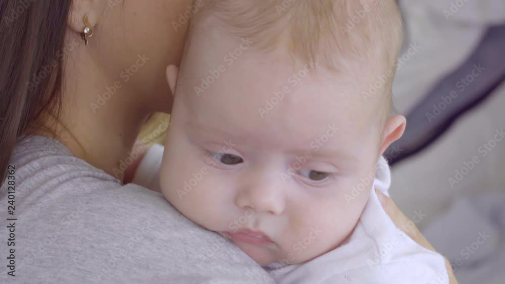 Young mother with her little baby. Happy moment, sweet scene, pastel colors Young mother with her little baby. Happy moment, sweet scene, pastel colors