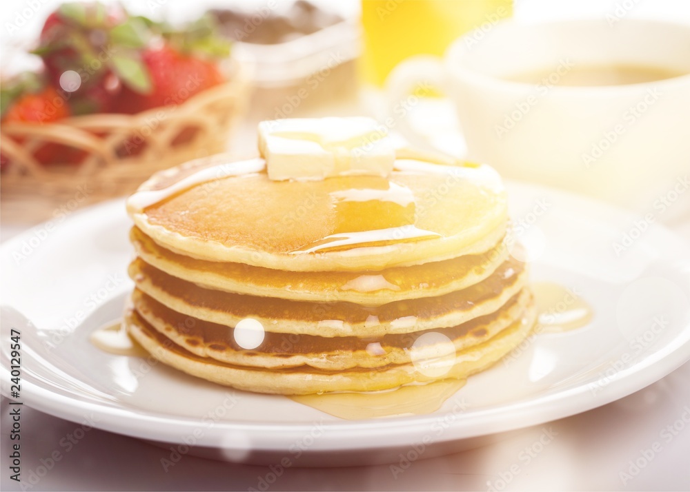 Stack of Small pancakes in syrup on background Stack of Small pancakes in syrup on background