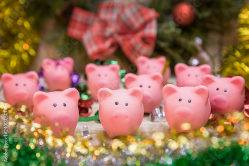 Cute pink pig toys in a festive environment. Selective focus. Christmas and new year 2019 concept. Pig symbol of 2019 on the Chinese calendar.