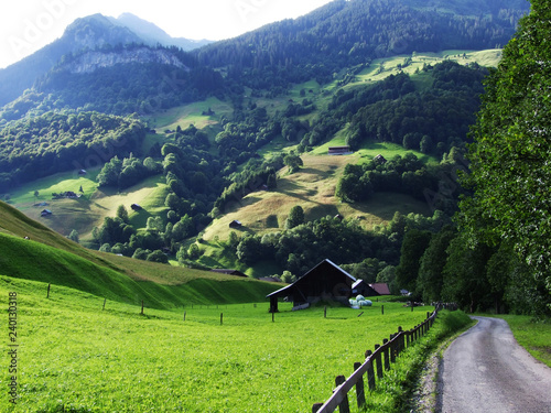Ponds and hills in the valley Weisstannenthal - Canton of St. Gallen, Switzerland photo