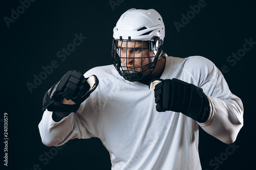 Emotional outraged ice-hockey player man gestures angrily, being provoked with the enemy, standing in fight pose. Sport, Negative emotions and rivalry concept