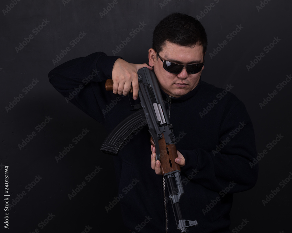 gangster with an AK-47 rifle gangster with an AK-47 rifle
