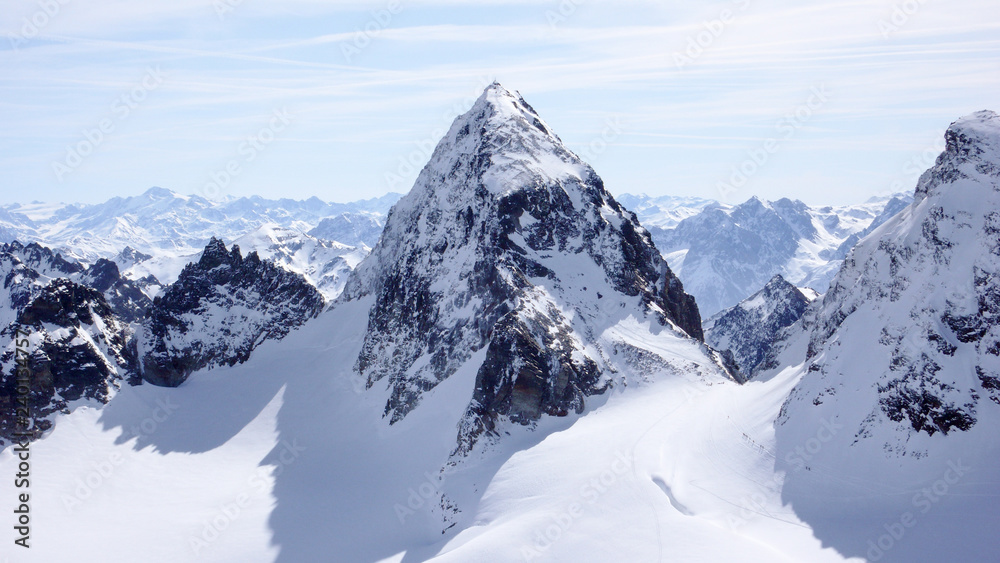 winter mountain landscape in the Silvretta mountain range in the Swiss Alps with famous Piz Buin mountain peak in the center winter mountain landscape in the Silvretta mountain range in the Swiss Alps with famous Piz Buin mountain peak in the center