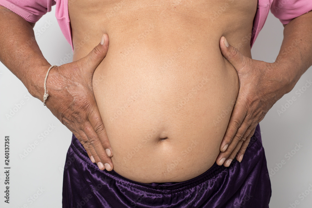 Overweight man hand pinching excessive belly fat on white background, Healthy concept Overweight man hand pinching excessive belly fat on white background, Healthy concept